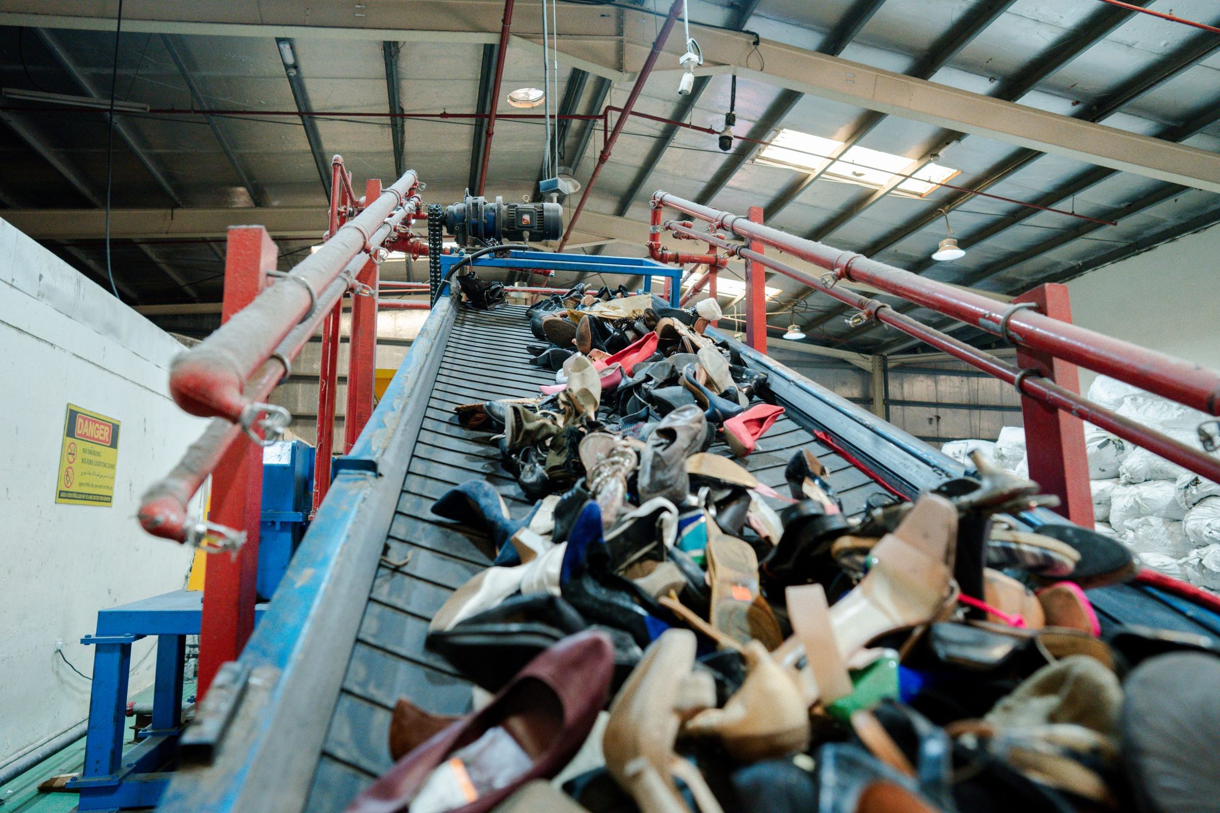 Mixed footwear on the infeed conveyor at the Hamriyah facility